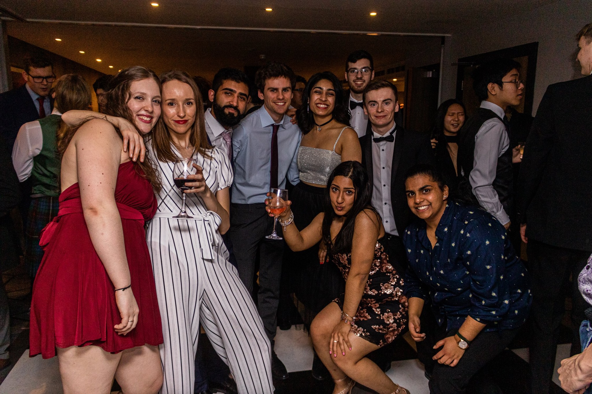 An image taken at the css ball, showing a group of friends posing for a photo
